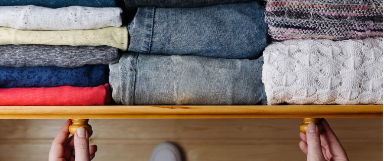 Neatly ordered clothes in drawers